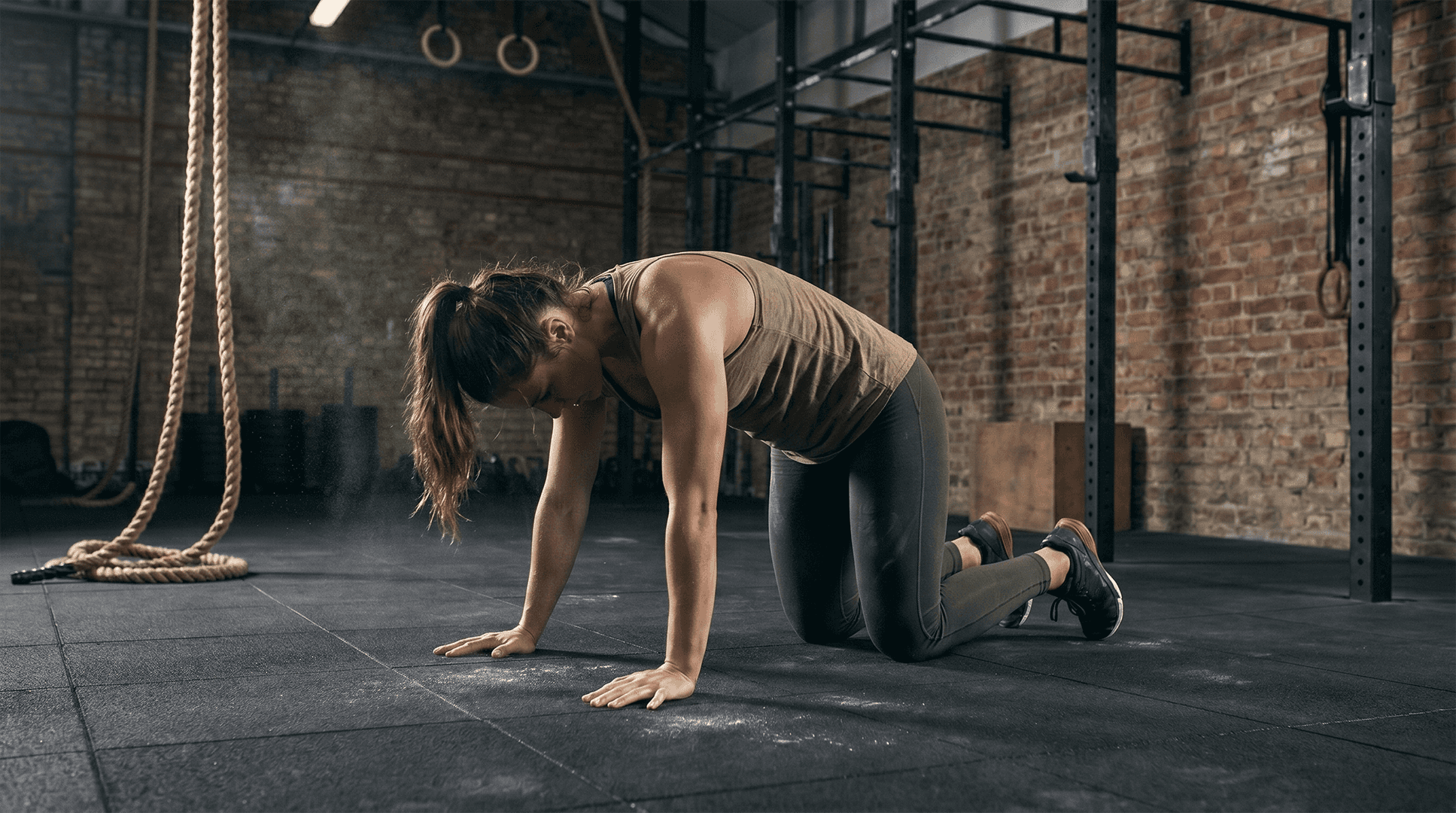Woman performing cat pose