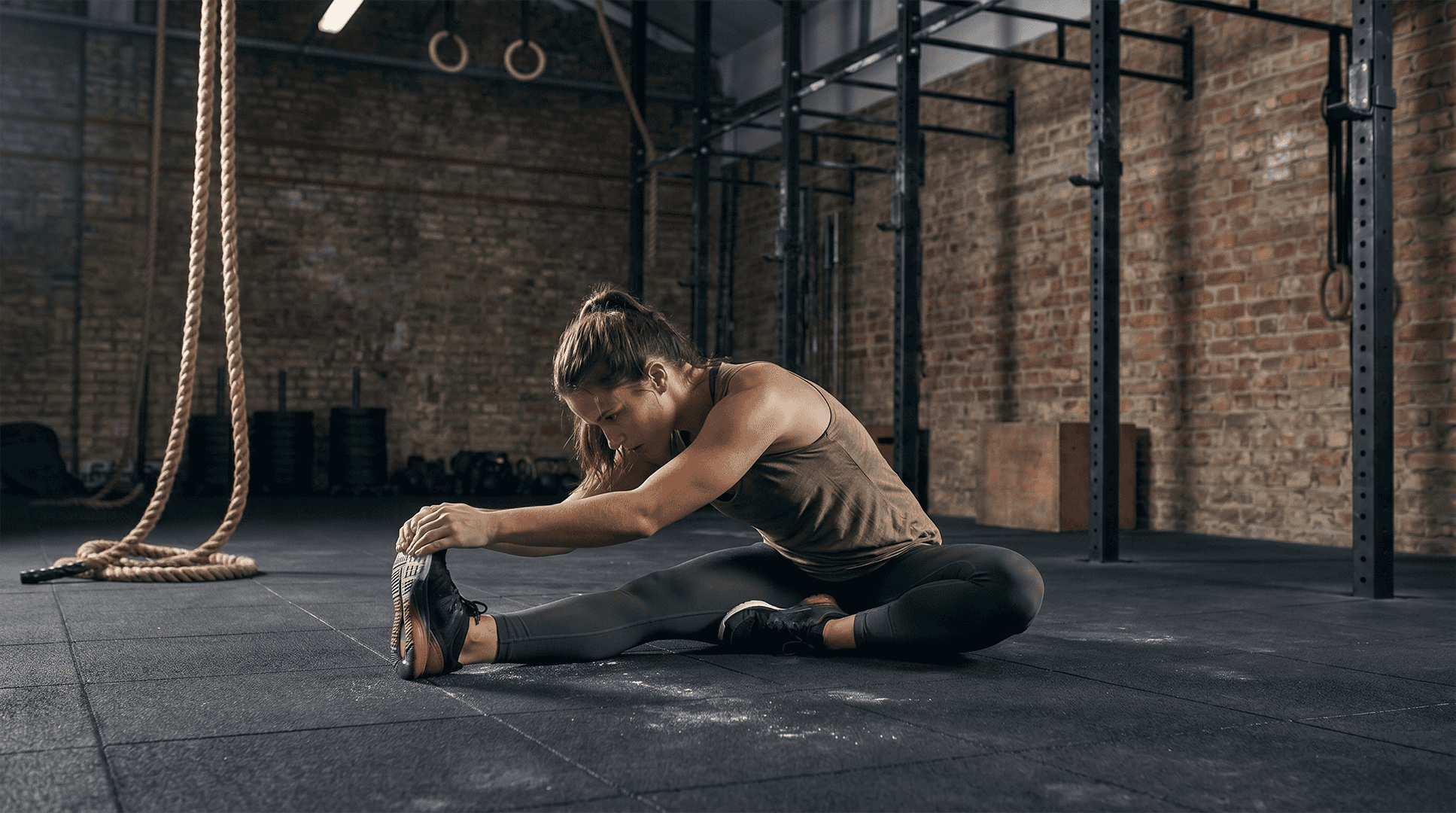 Woman performing a hamstring stretch