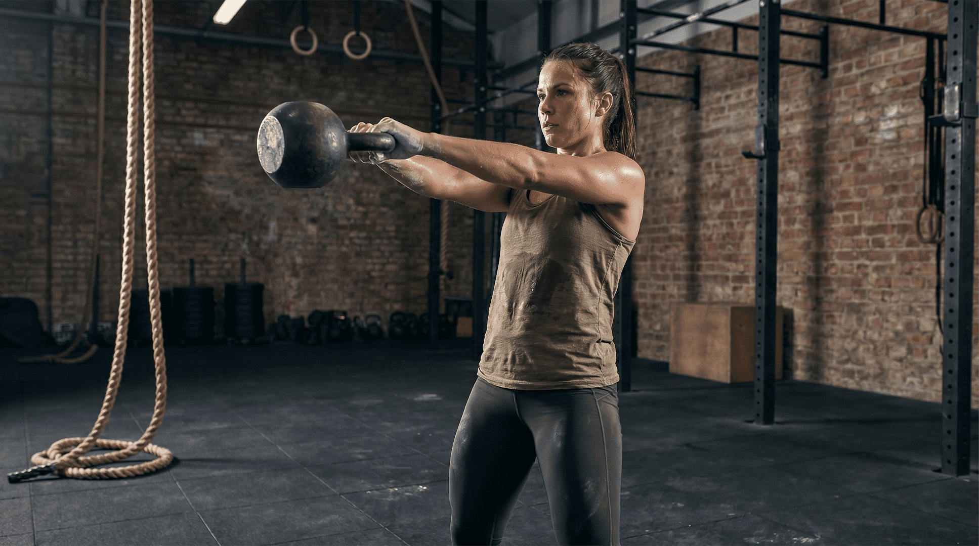 Woman performing kettlebell swings