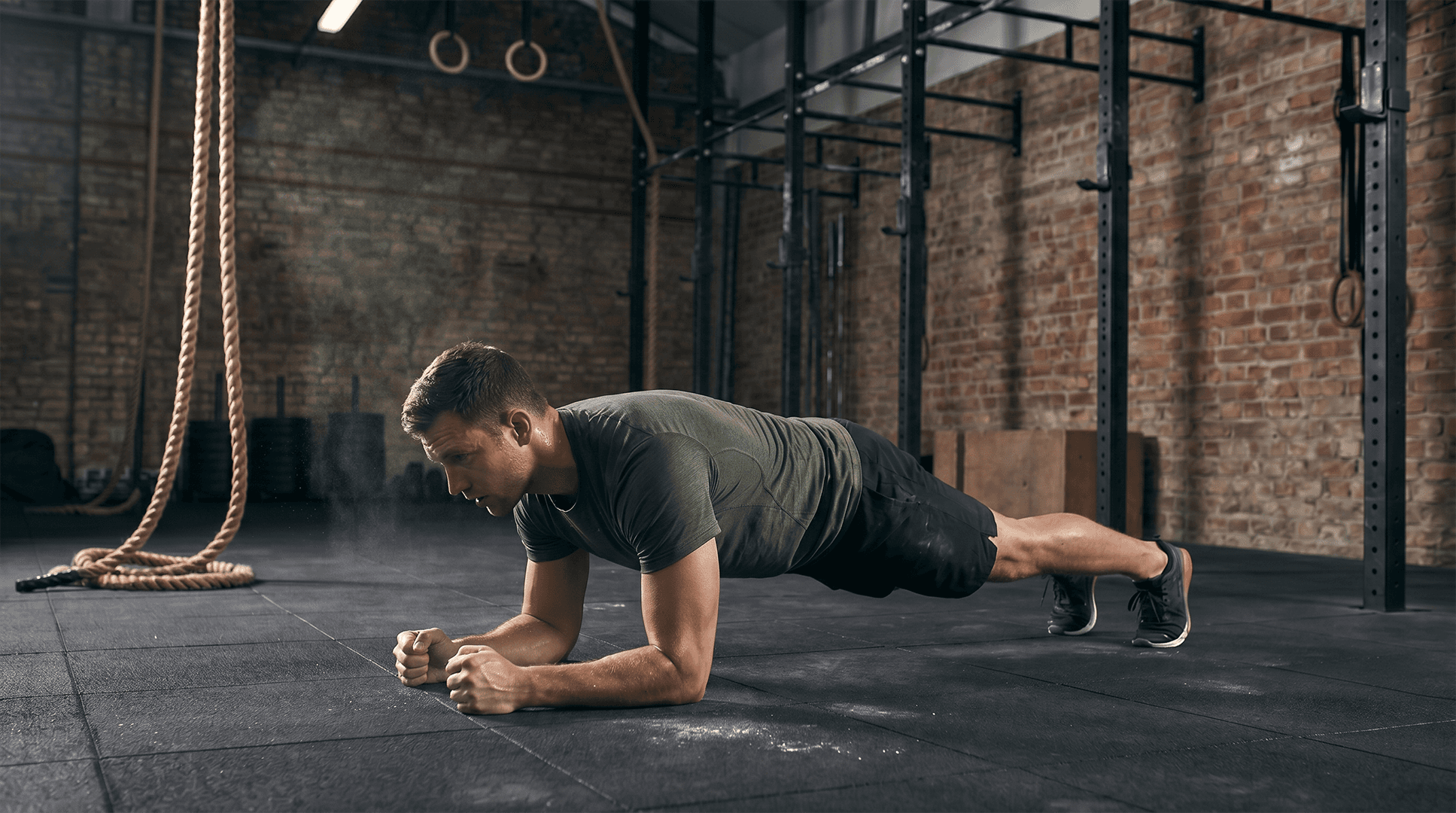 Man performing a forearm plank