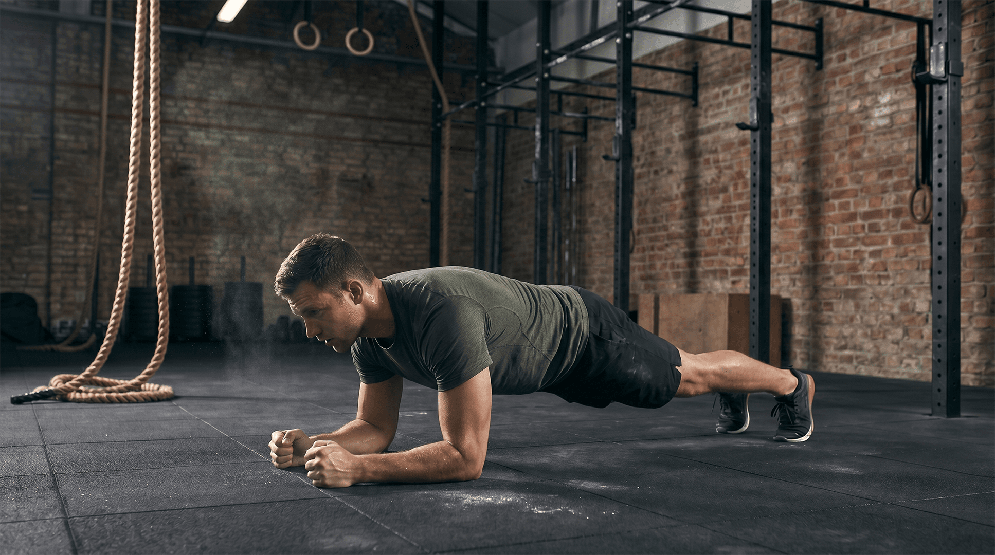 Man performing a forearm plank