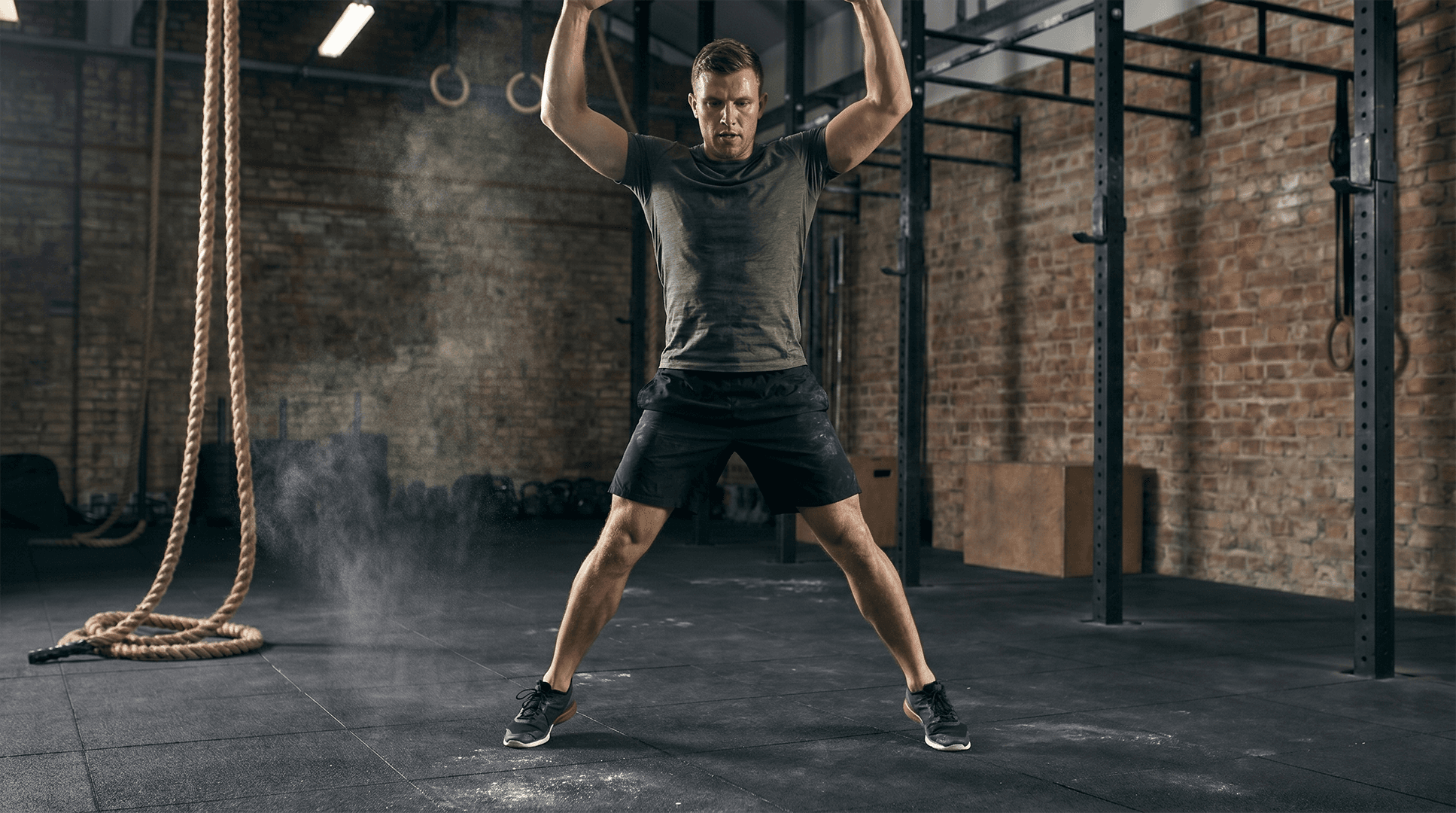 Man performing jumping jacks